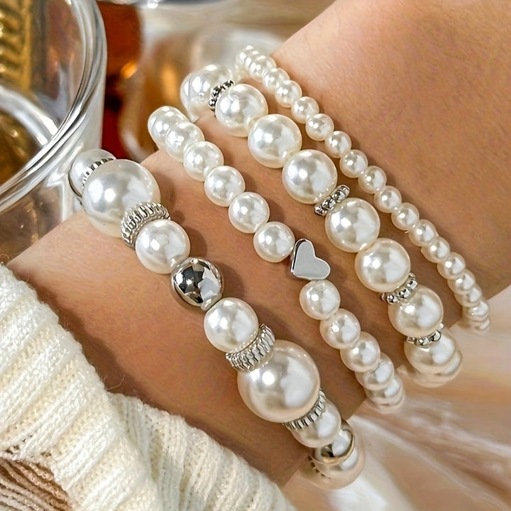 Juego de sofisticadas pulseras en forma de corazón adornadas con perlas