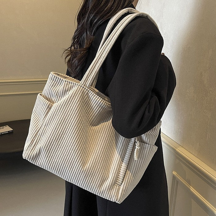 Tilda – Bolsa de hombro con diseño acanalado y detalle de cordón